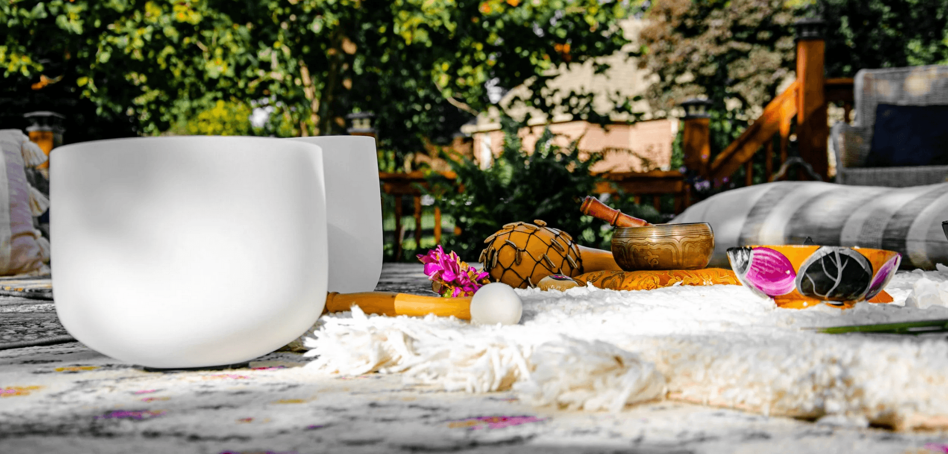 Sound healing bowls in a peaceful outdoor setting